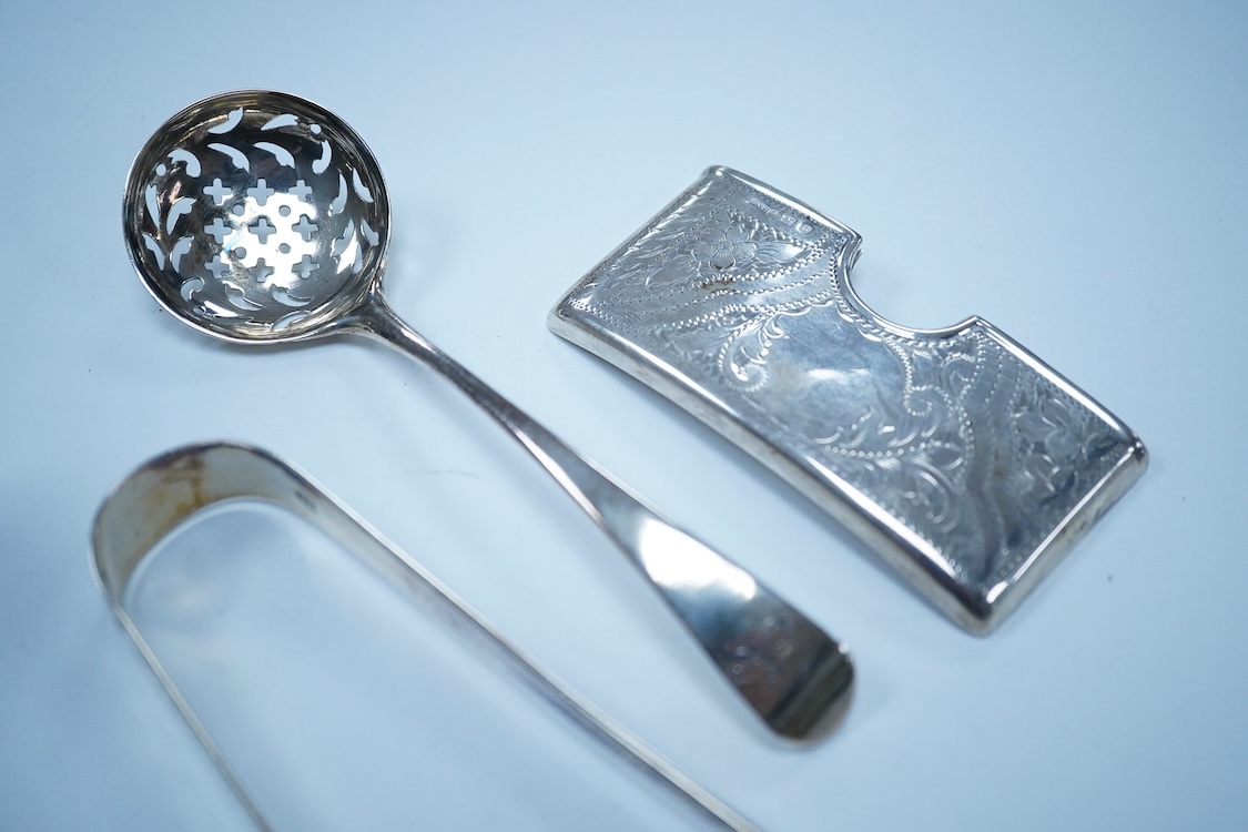 A collection of small silver to include a George V engraved concave card case, I. S. Greenberg & Co, Birmingham, 1912, 80mm, a cased late Victorian small bread fork, a modern mounted glass posy vase, an Irish nut dish, a